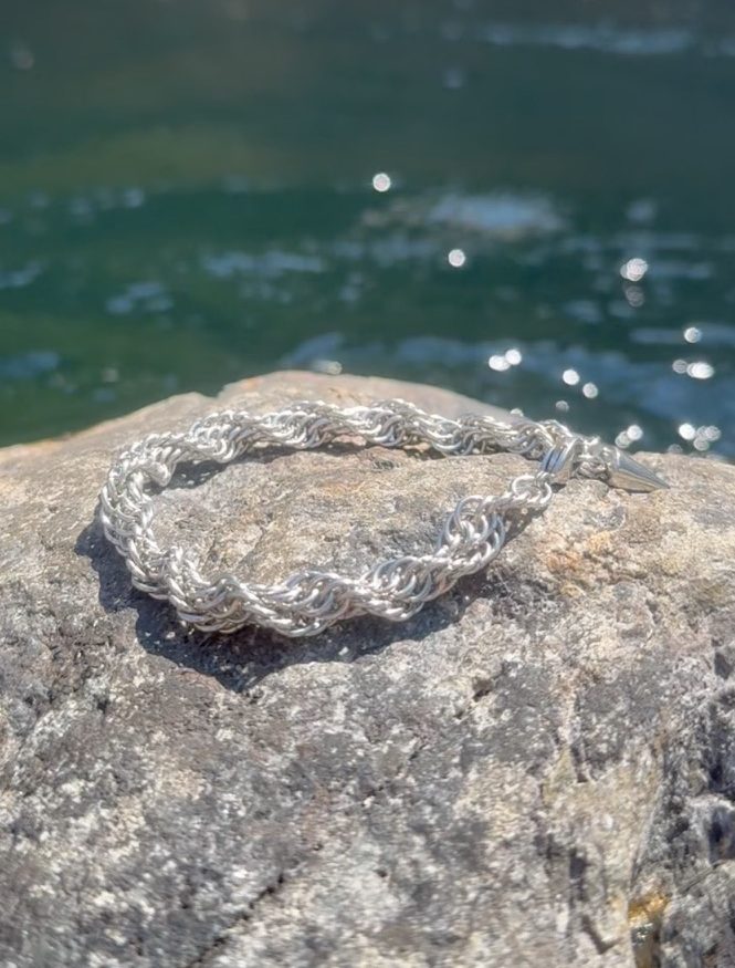Steel Kloth chain displayed on natural granite