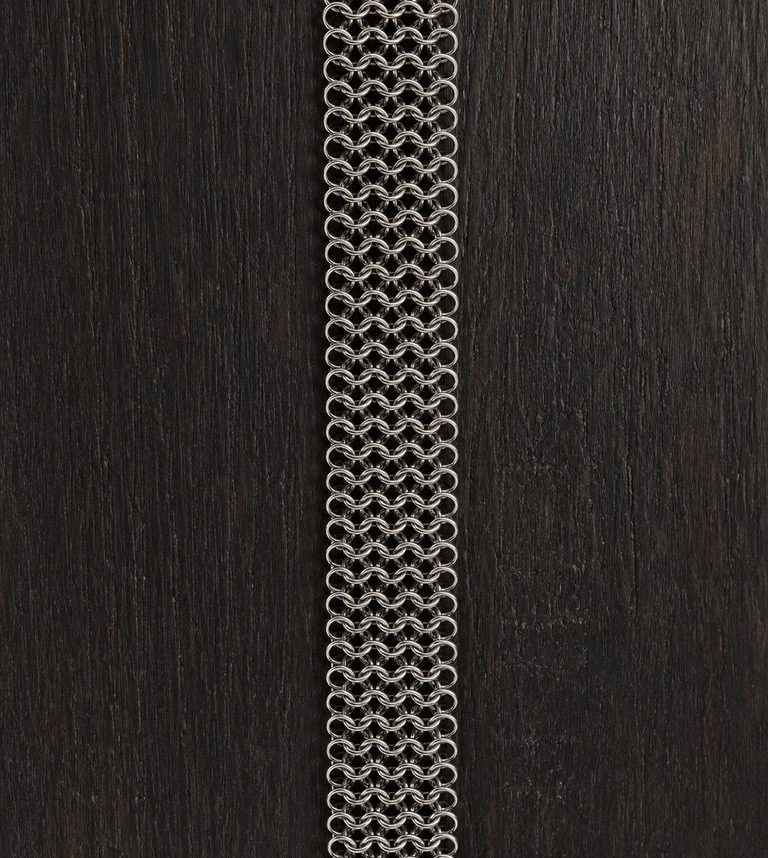 Handwoven stainless steel construction in progress